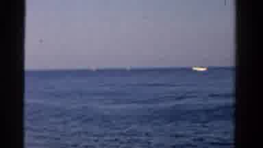 Ontario Canada (1958): Man Sitting On A Motor Boat On A Large Body Of Water