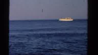 Ontario Canada-1958: Daylight Shot Of Small White Boat Floating On Open Sea At A