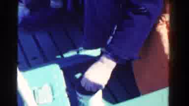 Ontario Canada (1958): Fisher Grabbing A Worm To Put In His Hook To Use As Bait