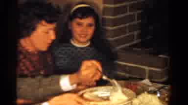 Ontario Canada (1958): A Group Of People Gather Around The Dinner Table As A Man