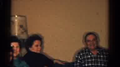 Ontario Canada (1958): A Group Of People Gathered Together Happily In A Room