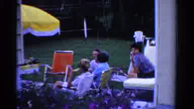 Ontario Canada (1958): Family Watches In Lawn Chairs While Relatives Play Lawn
