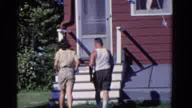 Ontario Canada (1958): A Man And Woman Walking In The House And Waving Bye
