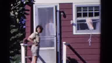 Ontario Canada (1958): A Man And Woman Entering House And Talking To Someone
