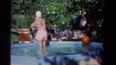 Ontario Canada (1958): Woman Puts On Swimming Cap In Backyard Pool