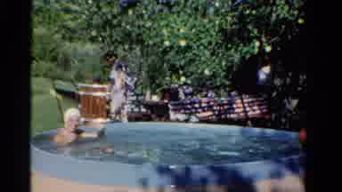 Ontario Canada (1958): Man Takes A Bath In The Pool Outside His House On A Very