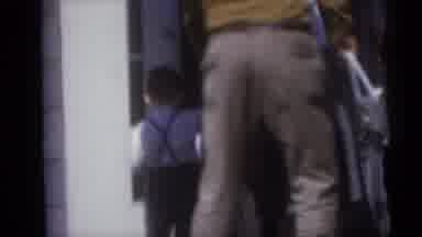 Camden New Jersey USA (1959): Man And Woman Walk Two Young Children Into The House