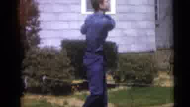 Camden New Jersey USA (1959): A Man Standing Next To A House Brings A Golf Club