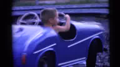 Camden New Jersey USA (1959): Little Boy Having Fun In A Mechanical Car At An
