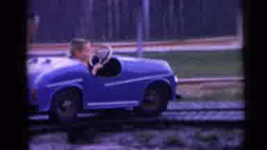 Camden New Jersey USA (1959): Kids Riding In Blue Amusement Park Car Ride On A