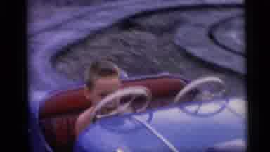 Camden New Jersey USA (1959): Boy Plays In A Car Attached To A Roller Coaster