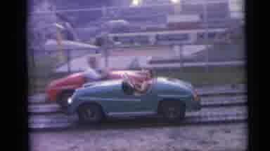 This girl's ride of choice? Amusement park car...not the family minivan!