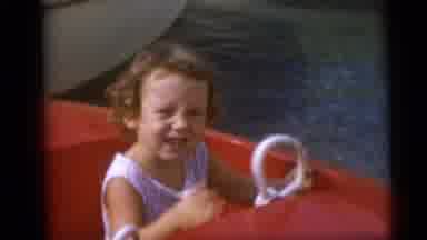 Camden New Jersey USA (1959): Curly Haired Toddler Girl On A Red Kiddie Boat And