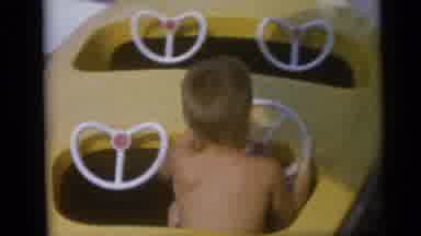 Camden New Jersey USA (1959): Kids Riding Red And Yellow Boat Ride On A Clear