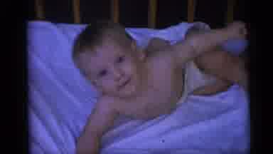 Camden New Jersey USA (1959): A Blond Blue-Eyed Baby Boy Lays In His Bed And Then