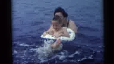 Camden New Jersey USA (1959): Two Kids Are Having Fun Swimming With Their Grandma