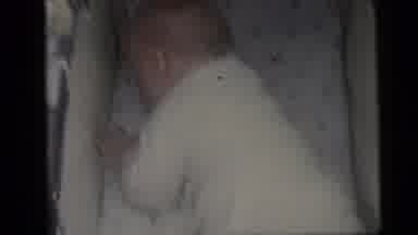 Camden New Jersey USA (1959): Baby In A Bassinet Flipping Around And Not Looking