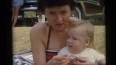 Camden New Jersey USA (1959): The Baby Sitting On The Mother's Lap And The Mother