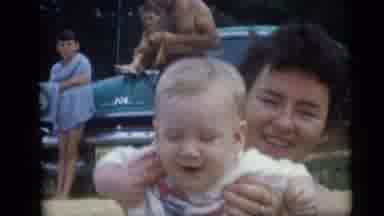 Camden New Jersey USA (1959): A Mother Is Playing With Her Child While With The