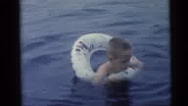Camden New Jersey USA (1959): Kids Play With Inflatable Water Toys In Lake In A