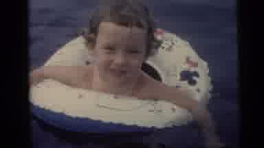 Camden New Jersey USA (1959): Young Girl In An Inflatable Inner Tube Swimming In