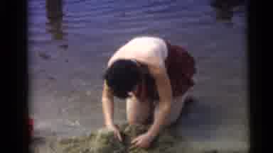 Camden New Jersey USA (1959): The Girl Is Sitting And Searching Something In The