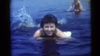 Camden New Jersey USA (1959): Woman On A Board Doggy Paddling In The Water At The