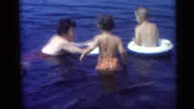 Camden New Jersey USA (1959): A Person Try To Swimming In Their Children They Are