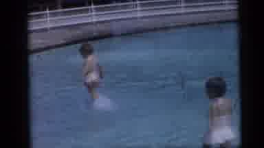 CAMDEN NEW JERSEY USA-1959: Two Little Girls Play in Swimming Pool