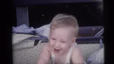 Camden New Jersey USA (1959): A Blond Baby Boy With Blue Eyes Sits And Smiles