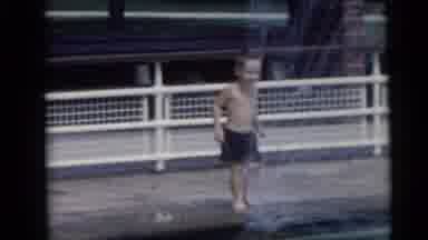 Camden New Jersey USA (1959): The Child Is Playing In The Water Using Ball