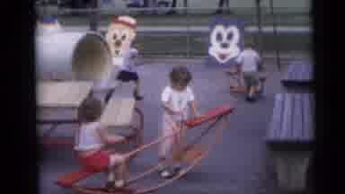 Camden New Jersey USA (1959): Four Small Children Playing On See Saws At A Fenced