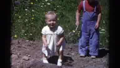 Catskill New York USA (1959): The Child Is Playing In The Garden They Are Enjoying