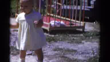 Catskill New York USA (1959): Baby Takes First Steps In Backyard While Parents