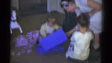 Catskill New York USA (1959): Children Uncover Gifts Mother Helps Them Doll In