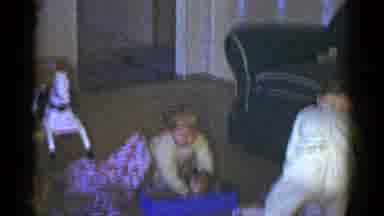 Catskill New York USA (1959): Toddler Wearing Yellow Sweater Removes Doll From