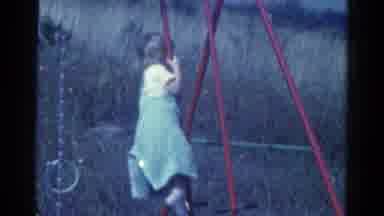 Catskill New York USA (1959): Little Blonde Girl Wearing A Dress Playing On A Red
