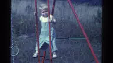 Catskill New York USA (1959): A Little Girl Plays Swing In The Garden He Is Very