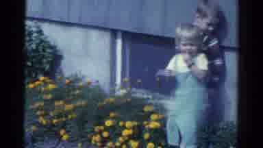 Catskill New York USA (1959): Recording Of Children Standing In A Garden Wiping