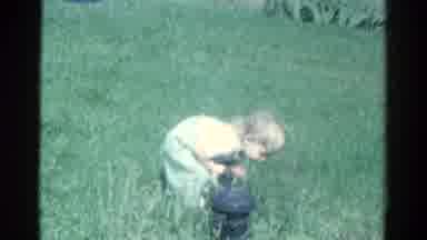 Catskill New York USA (1959): Baby Girl Outside In The Wind In A Meadow Picking