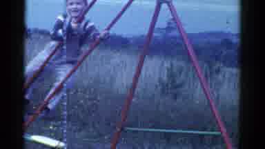 Catskill New York USA (1959): Boy Plays On Backyard Swing Set While Cats Fight