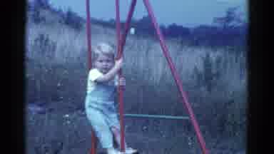 Catskill New York USA (1959): Red Swinging Child In Park Setting By Field With
