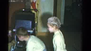 Catskill New York USA (1959): Children In Pyjamas Play With Pet Near Car At Home