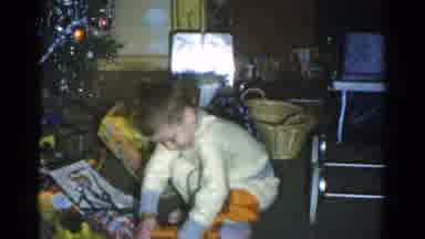 Catskill New York USA (1959): Little Boy Happily Playing With One Of The Toys He