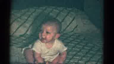 Catskill New York USA (1959): Child Peeking Through A Doorway And Smiling While A