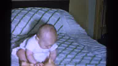 Catskill New York USA (1959): Baby Toddler Sitting On A Bed As He Gets Surprised