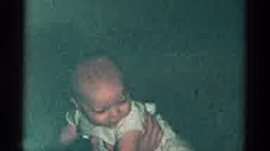 Catskill New York USA (1959): A Baby Being Held And Giggling While Smiling And