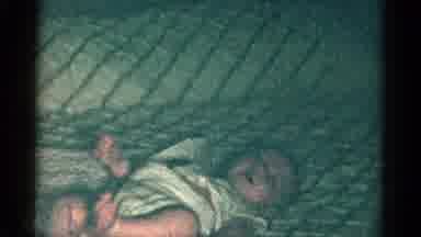 Catskill New York USA (1959): A Baby Is Acting Fussy On Their Back But Flips Onto