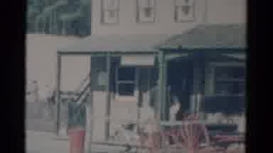 Catskill New York USA (1959): Man Wearing White Shirt Walks Into Store Building On