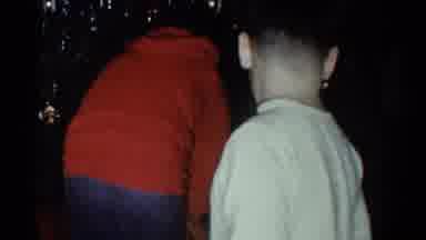 Catskill New York USA (1959): Young Kids Wearing Pajamas Opening Up Their